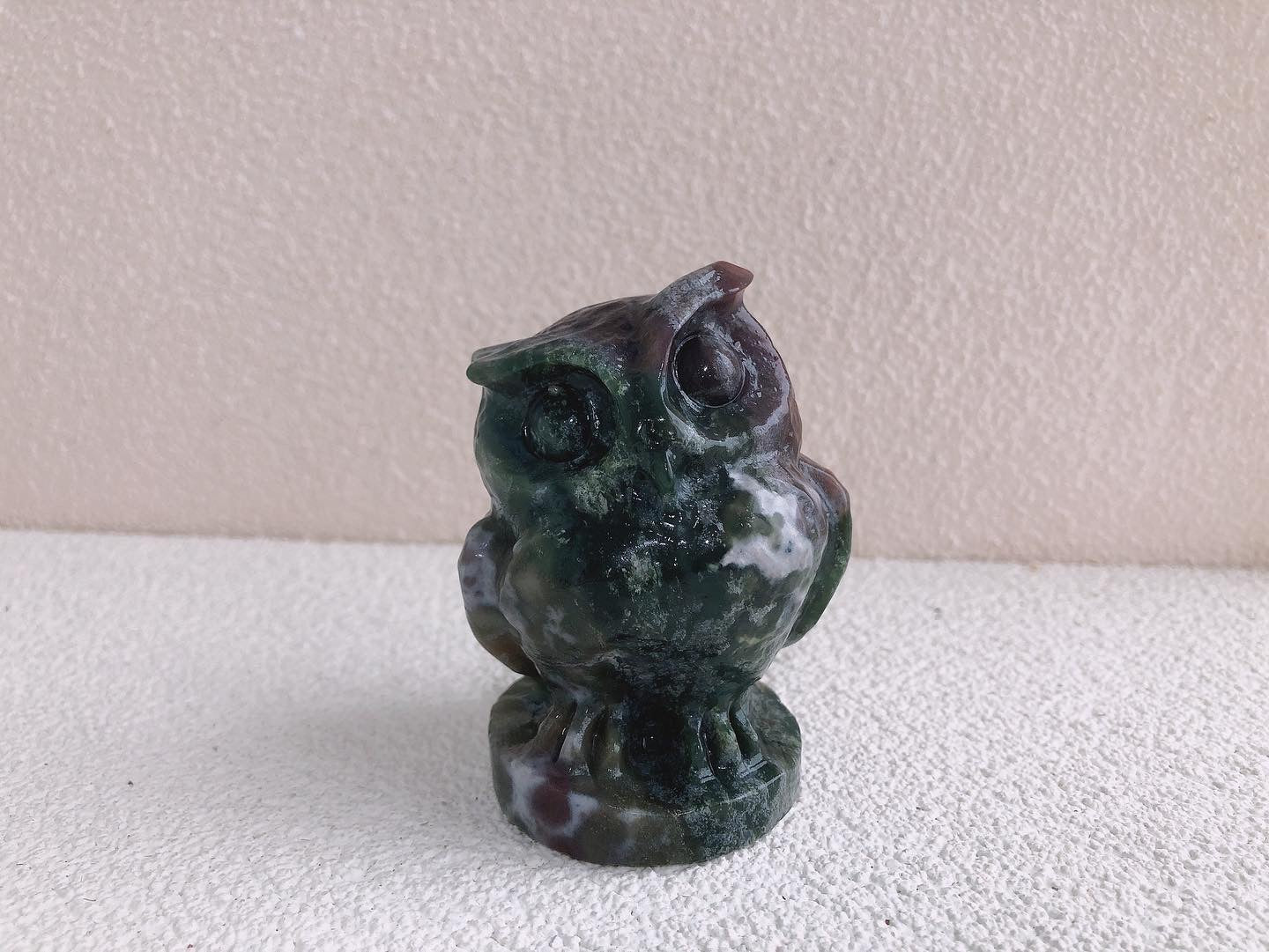 Moss agate owl carving