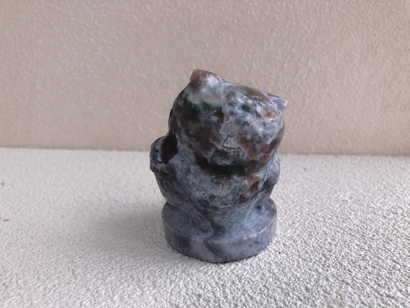 Moss agate owl carving