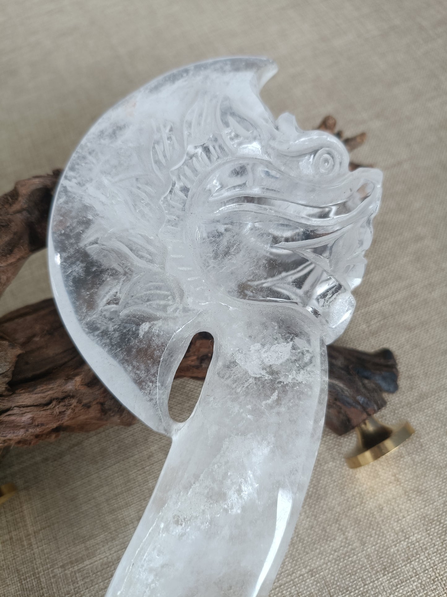 Clear quartz axe carving
