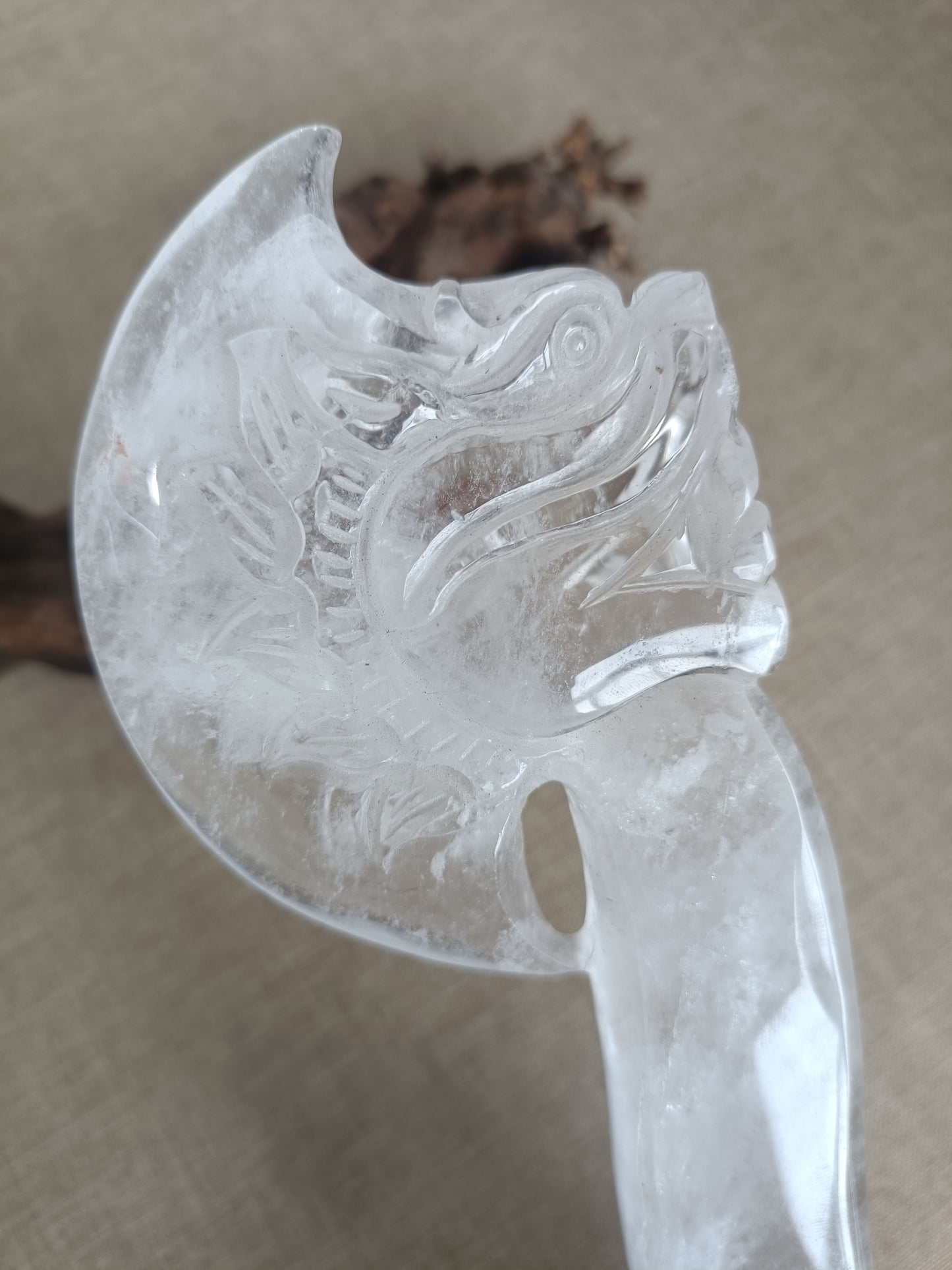 Clear quartz axe carving