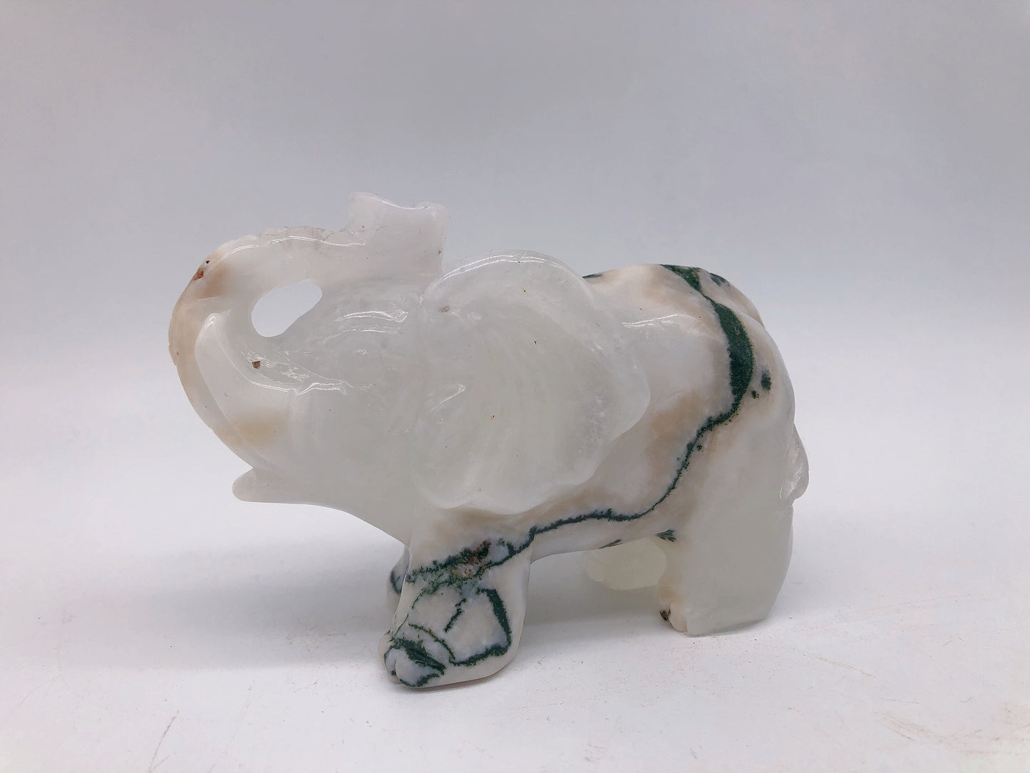 Moss agate elephant carving
