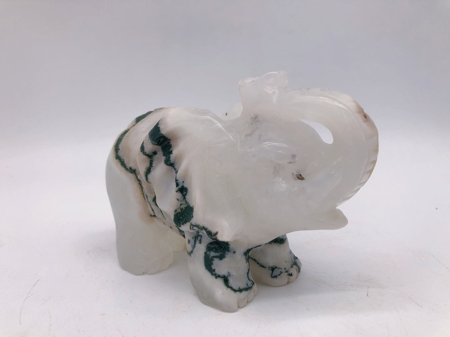 Moss agate elephant carving