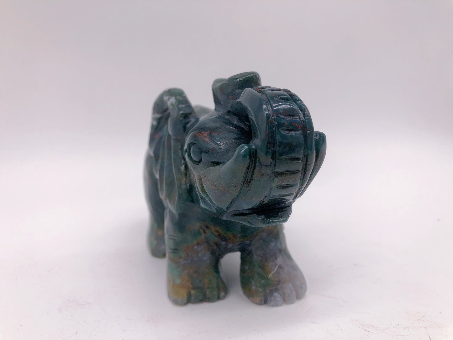 Moss agate elephant carving