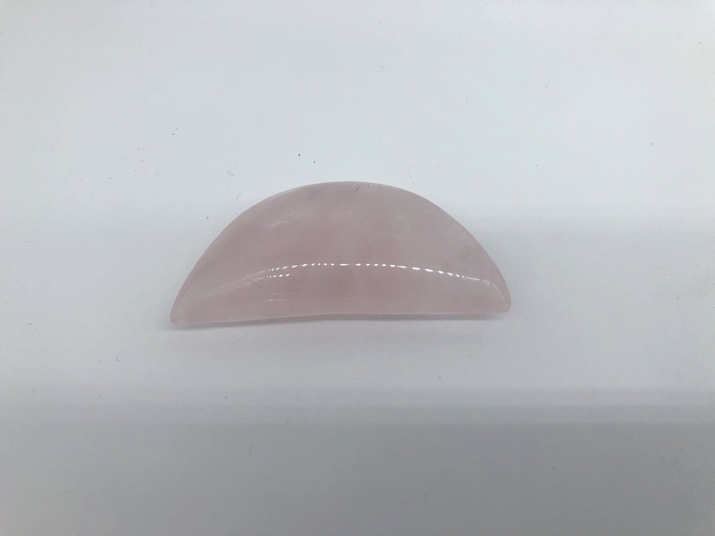 Rose quartz moon carving
