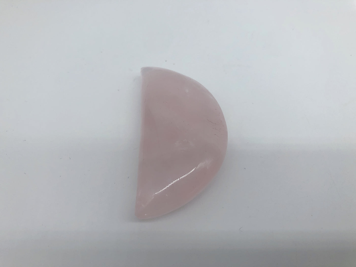 Rose quartz moon carving