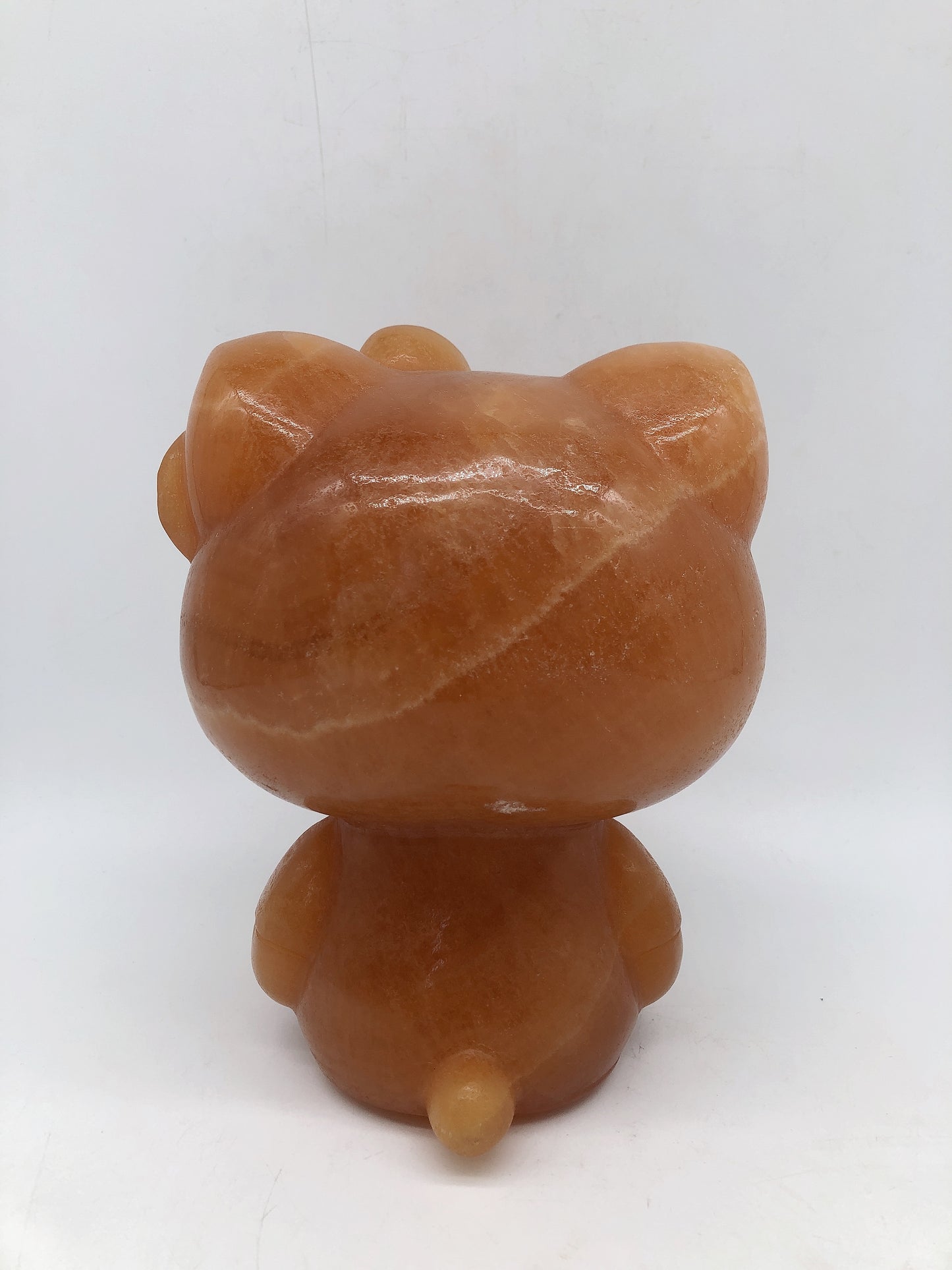 Big orange calcite hello kity carving