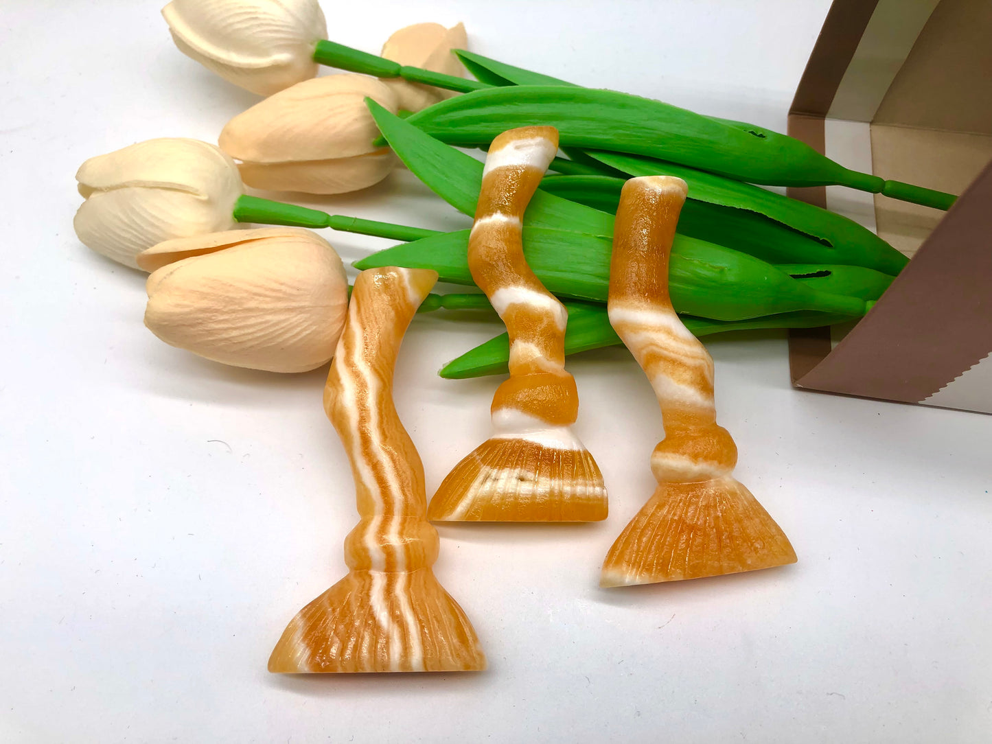 Orange calcite bessom carving
