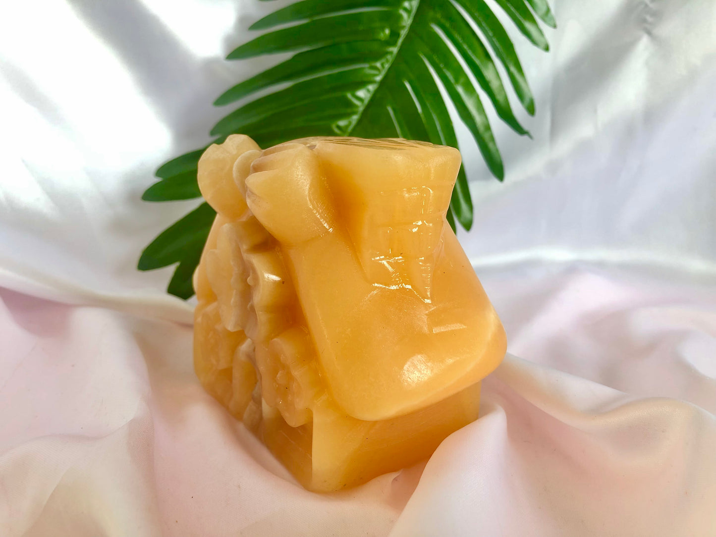 Orange calcite house carving