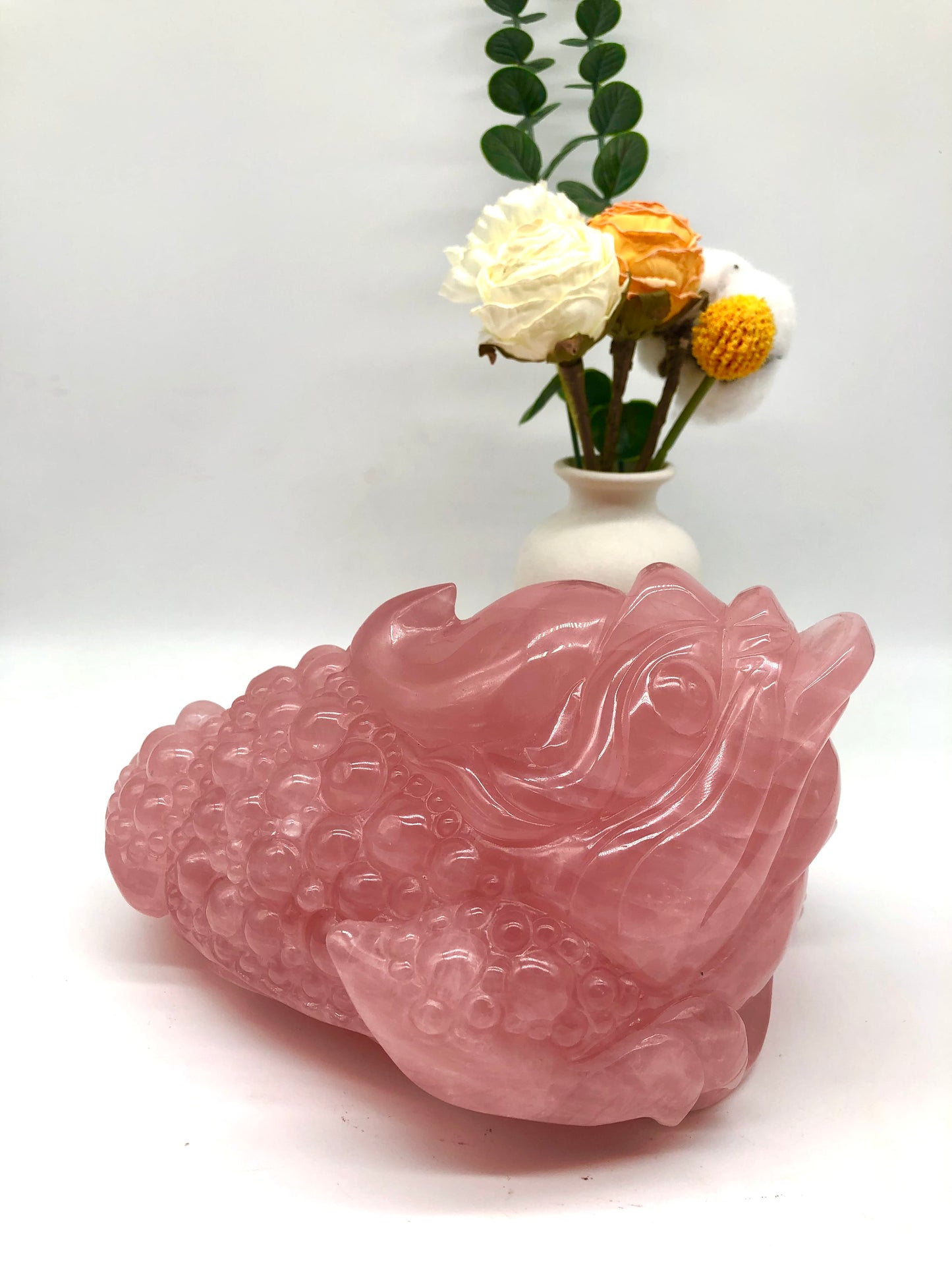 Rose quartz money frog carving