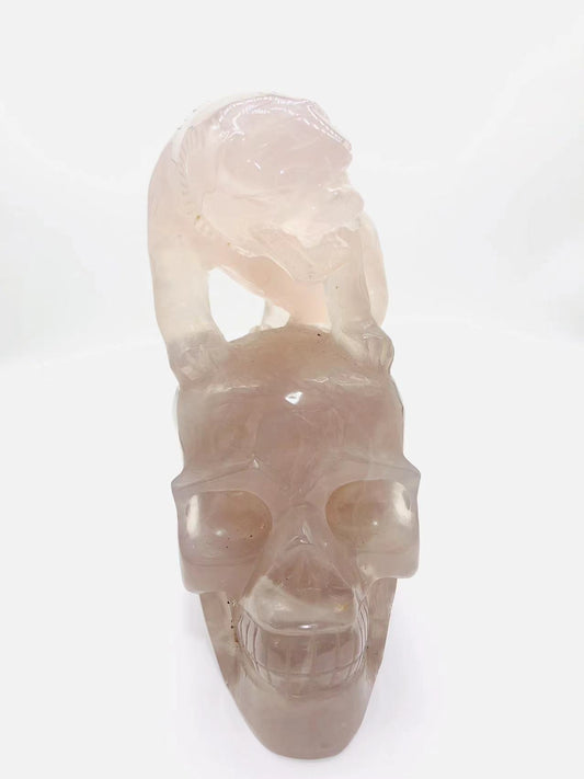 Blue rose quartz skull with tiger carving