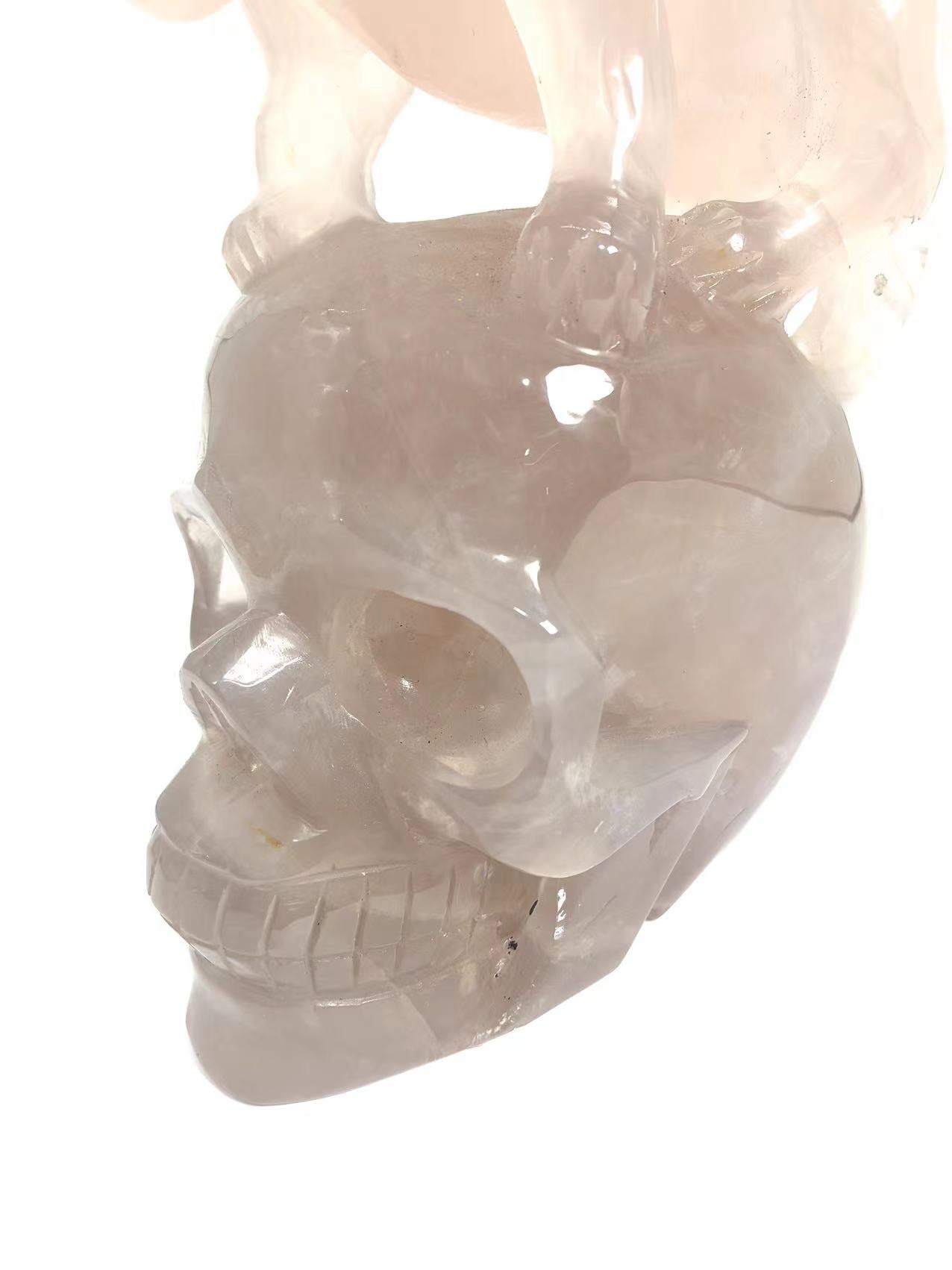 Blue rose quartz skull with tiger carving