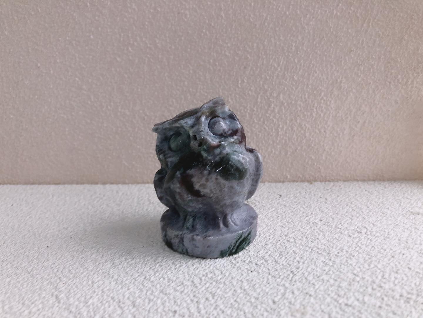 Moss agate owl carving