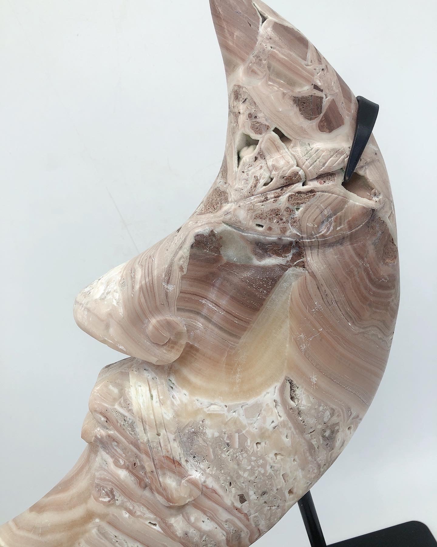Orange calcite moon face carving