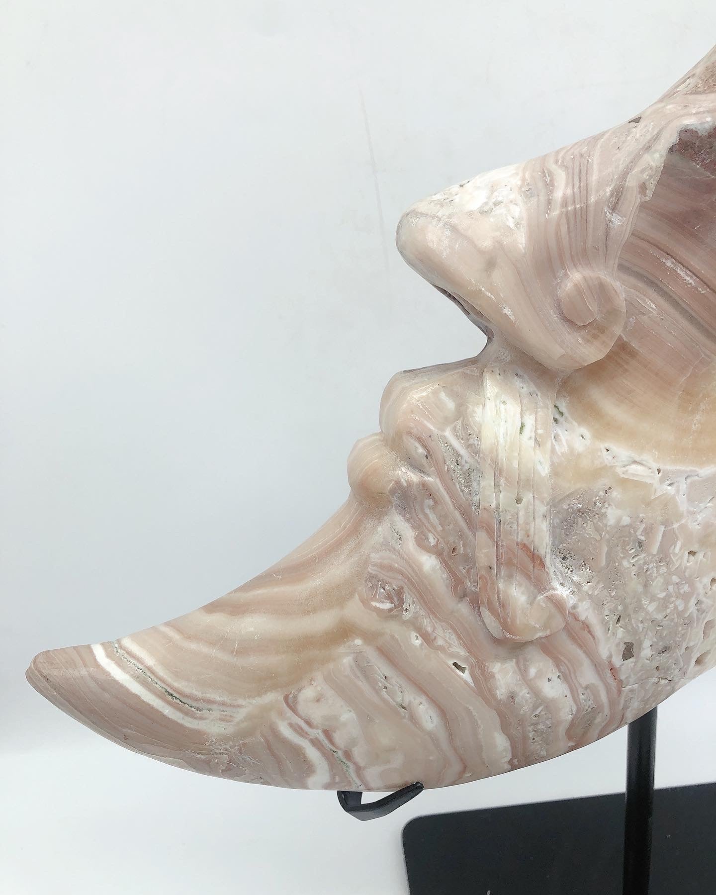 Orange calcite moon face carving
