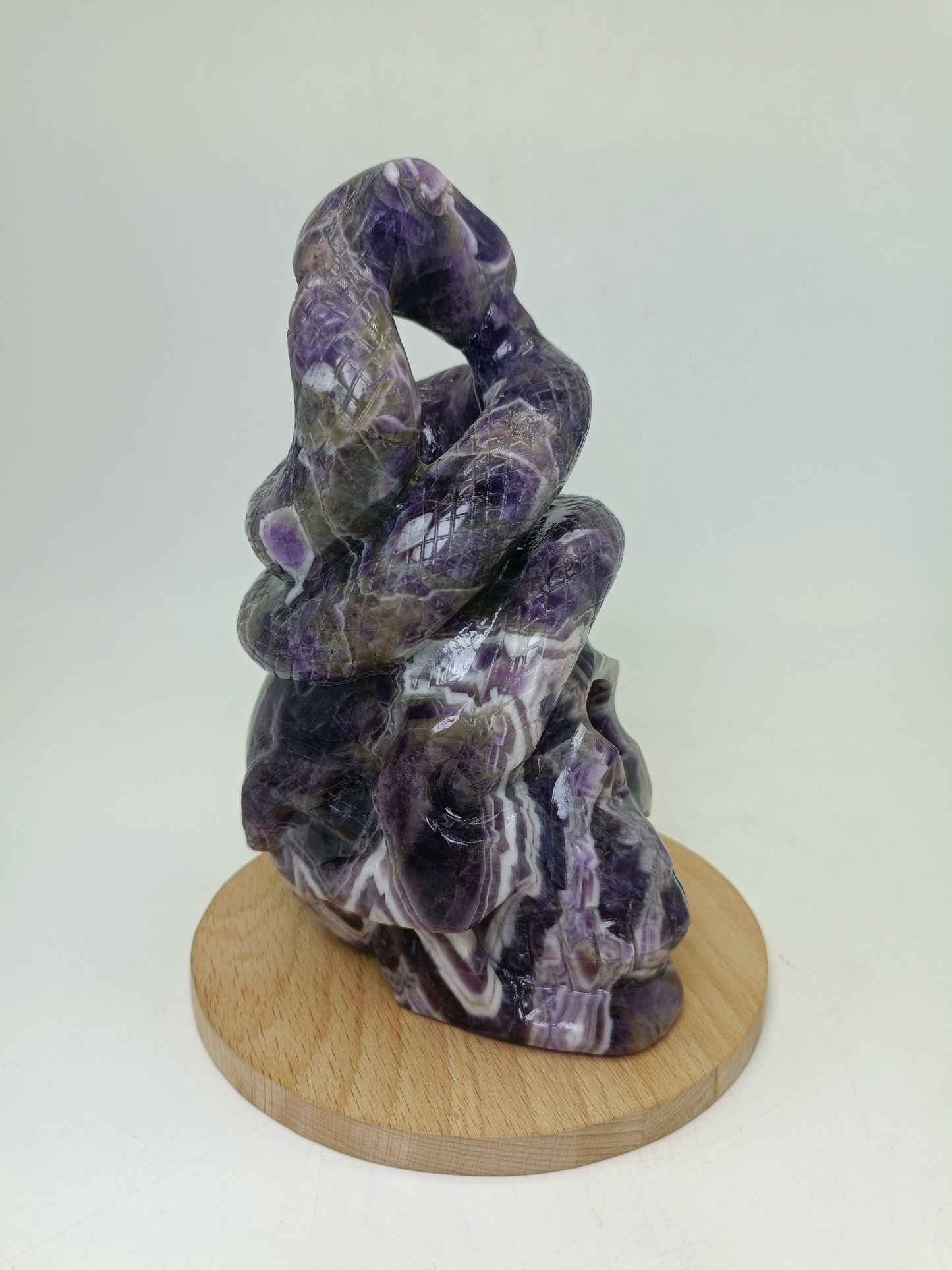 Amethyst skull with snake carving