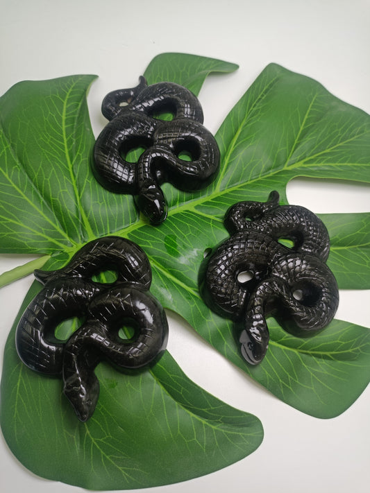 Silver obsidian snake carving