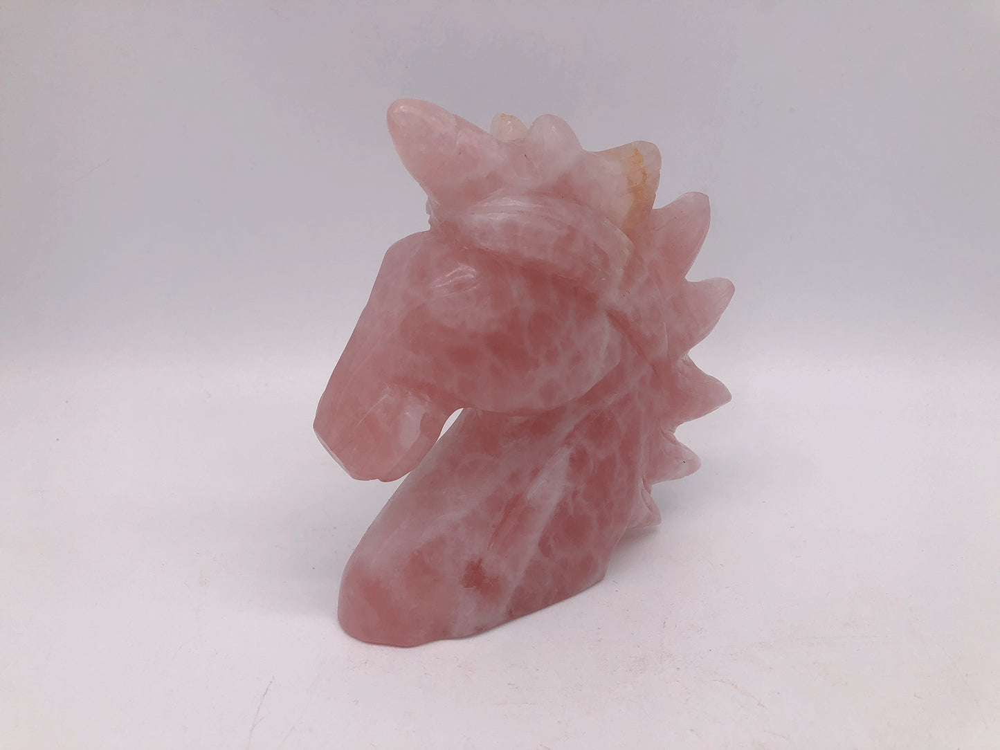 Rose quartz unicorn carving