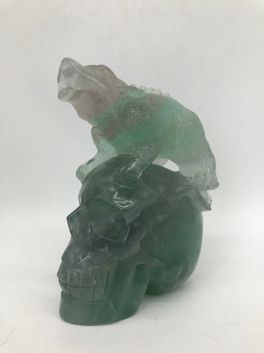 Fluorite skull with dinosaur carving