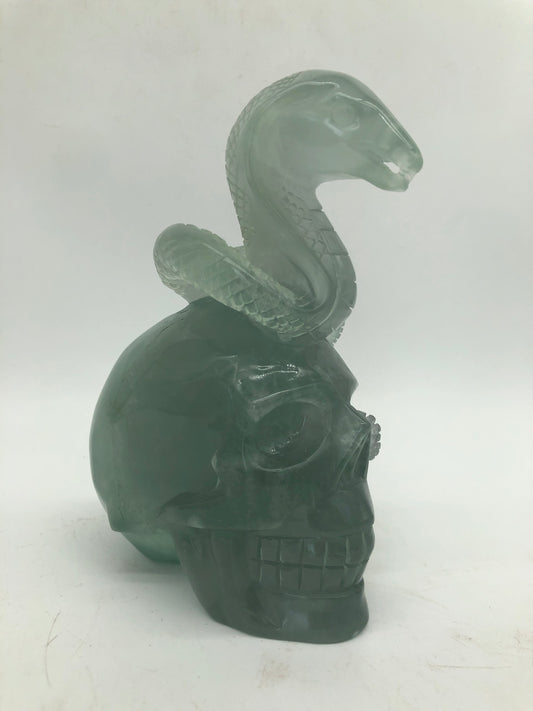 Fluorite skull with snake carving