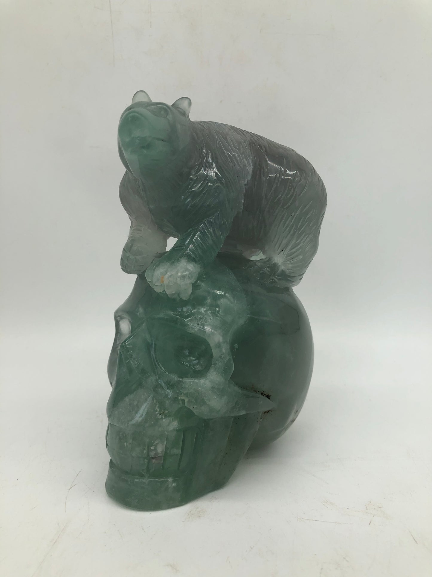 Fluorite skull with bear