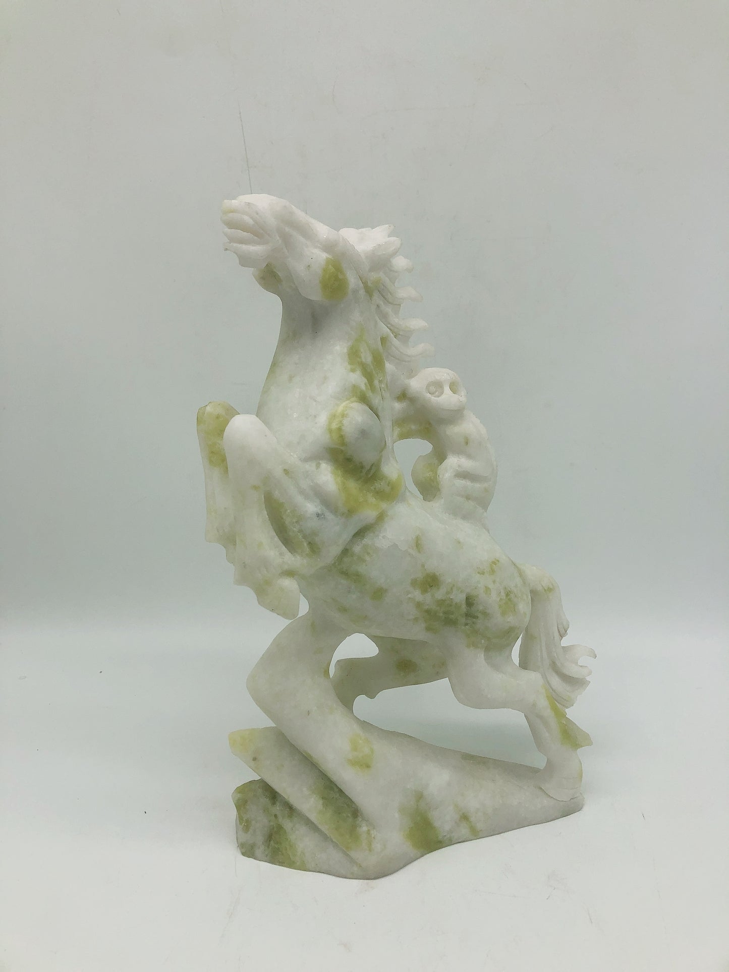 Lemon jade horse with monkey carving