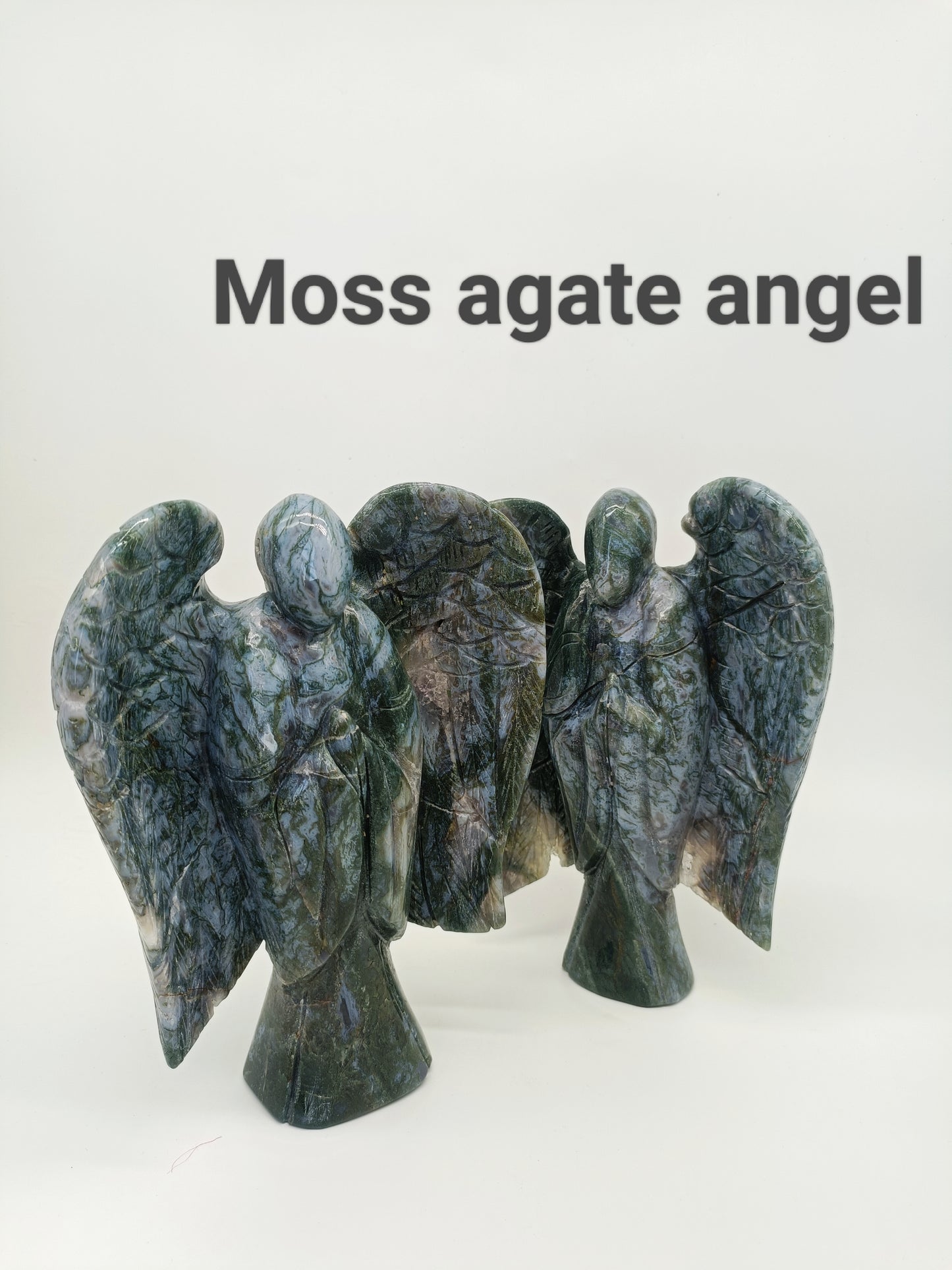 Moss agate angel carving