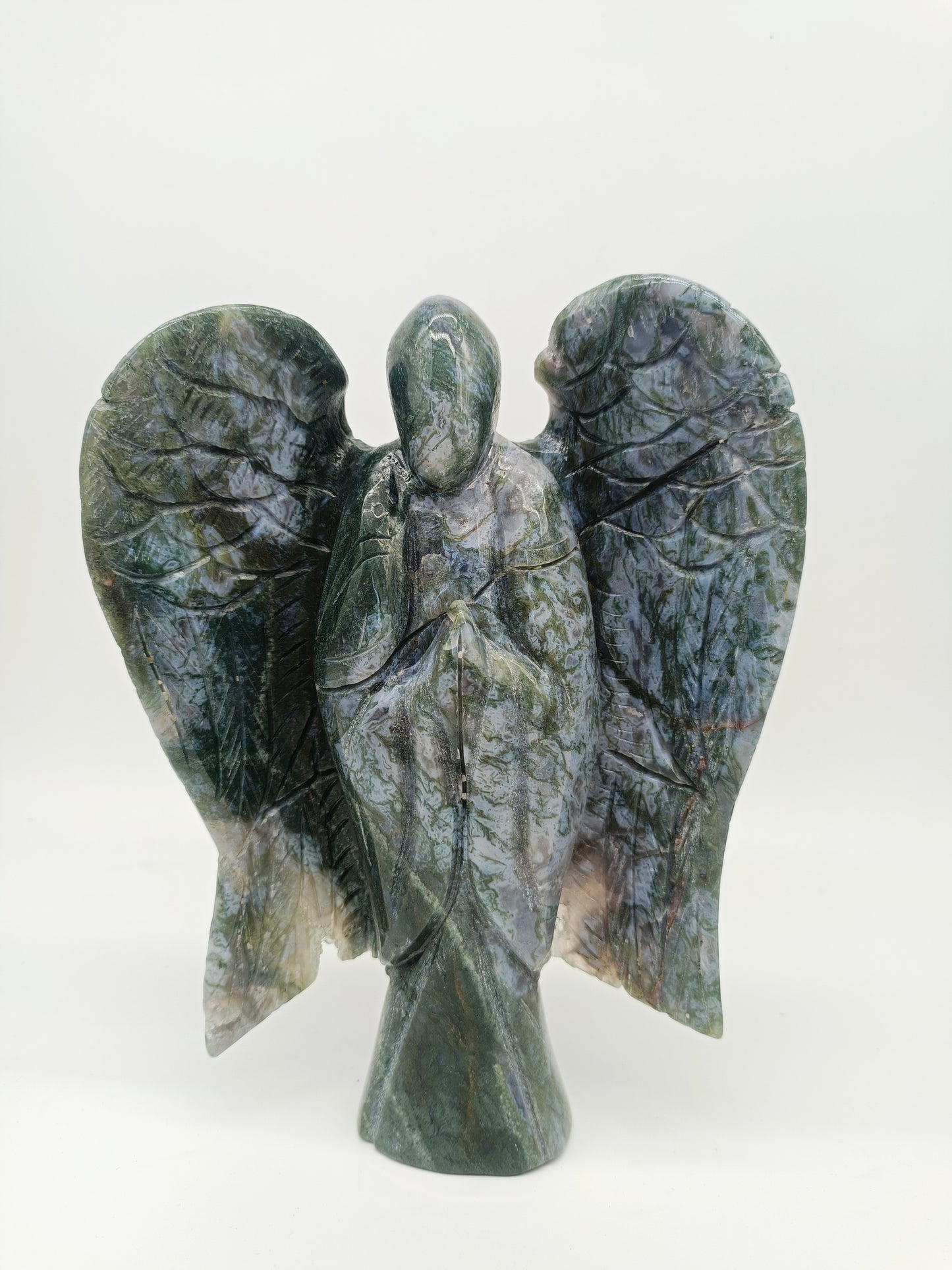 Moss agate angel carving