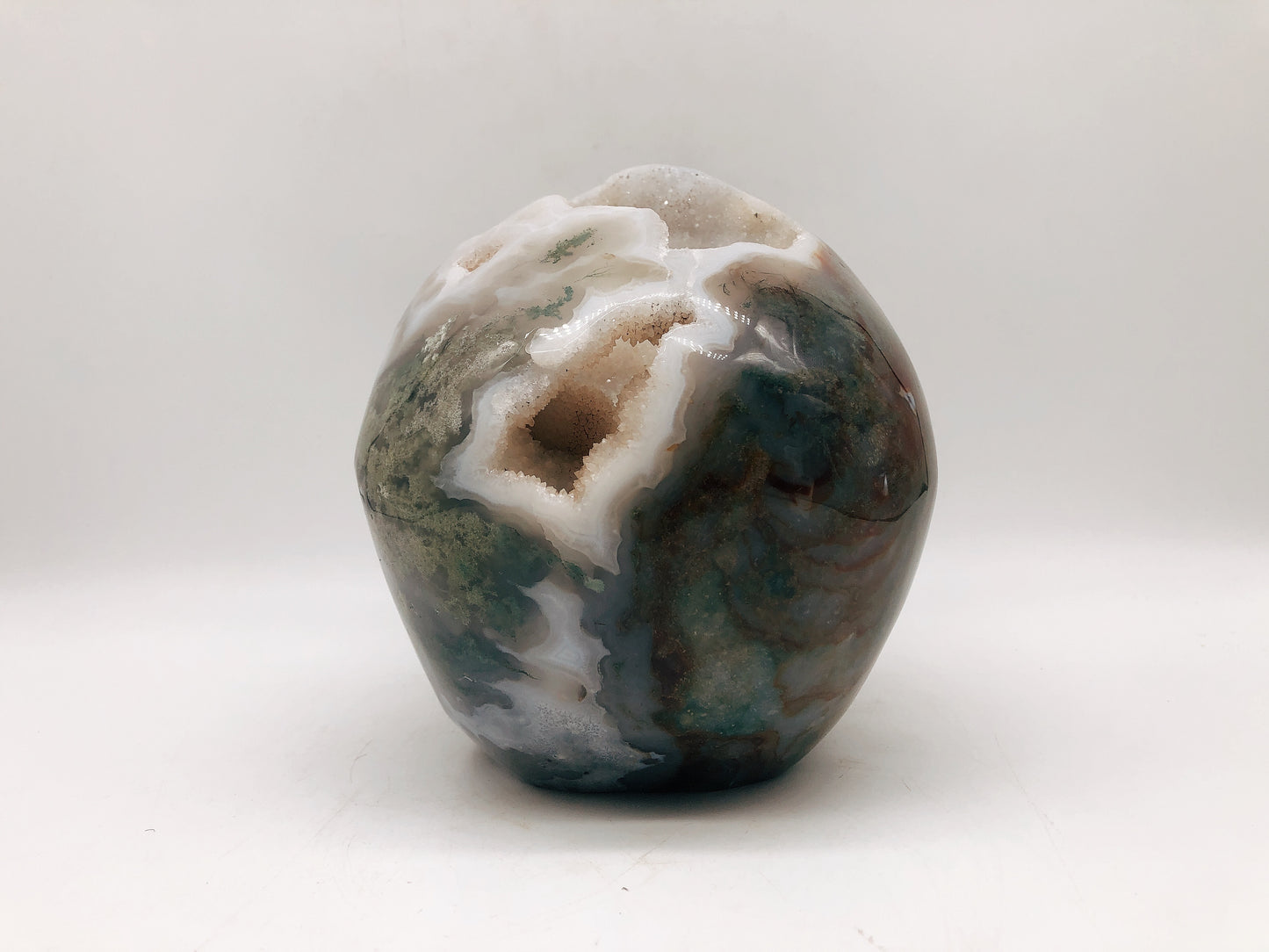 Moss agate skull carving