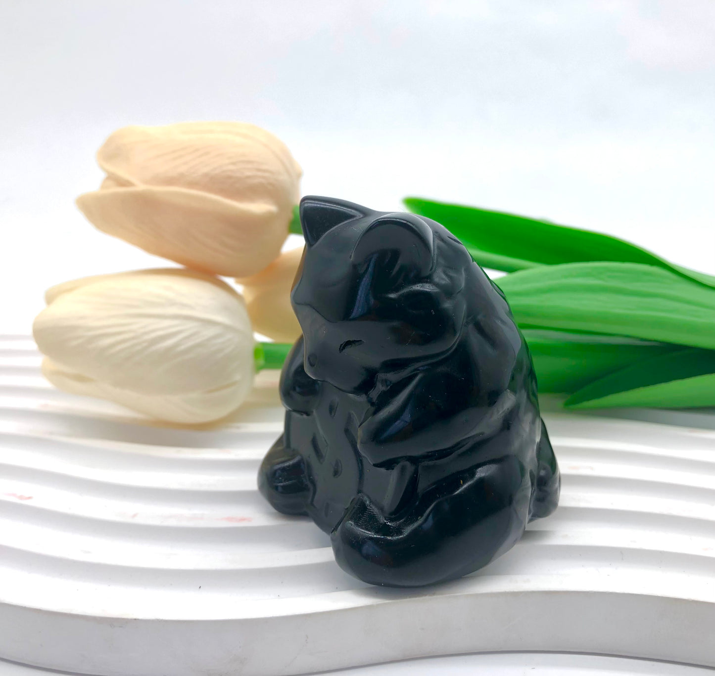 Black obsidian cat carving