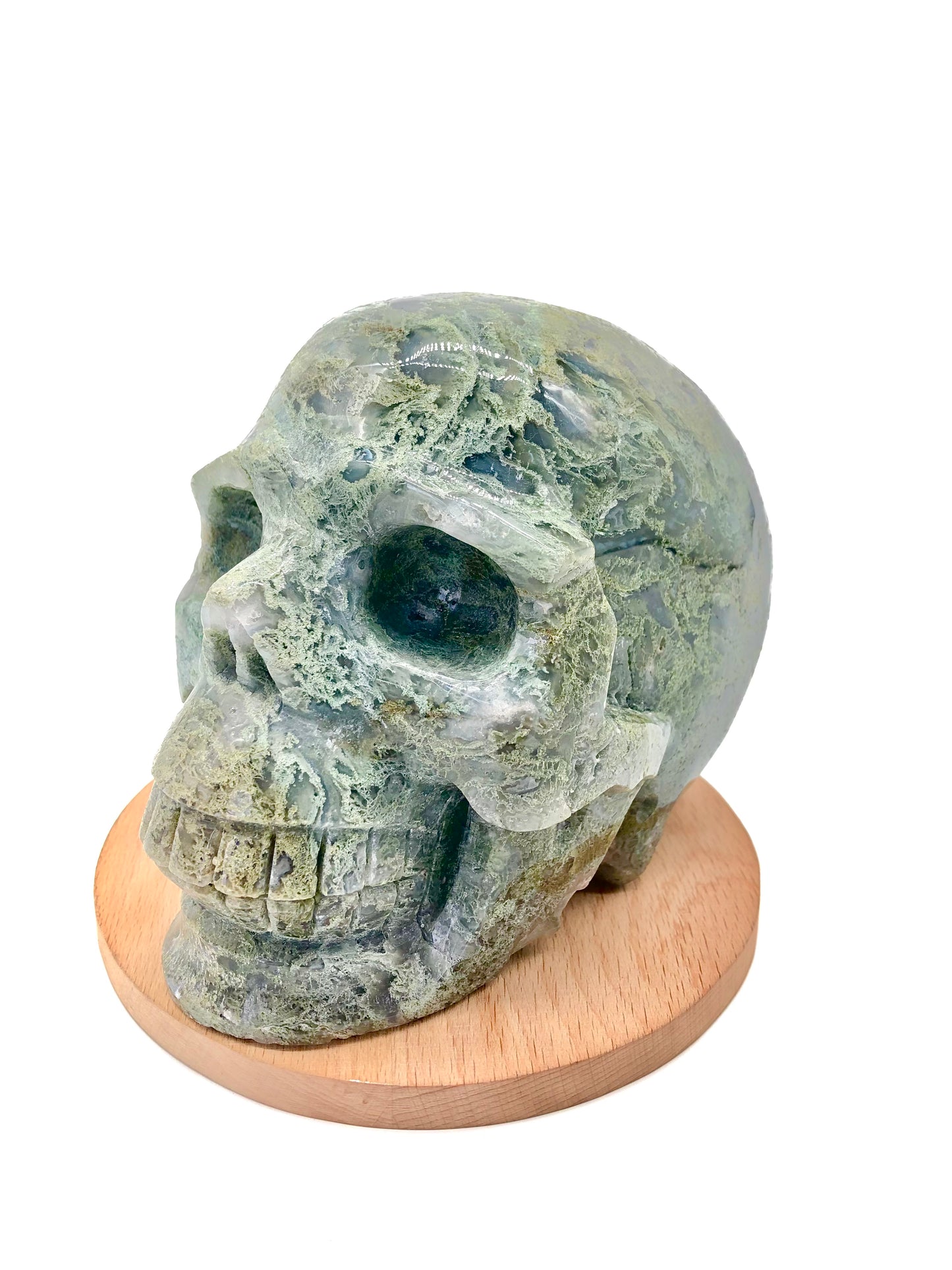 Moss agate skull carving