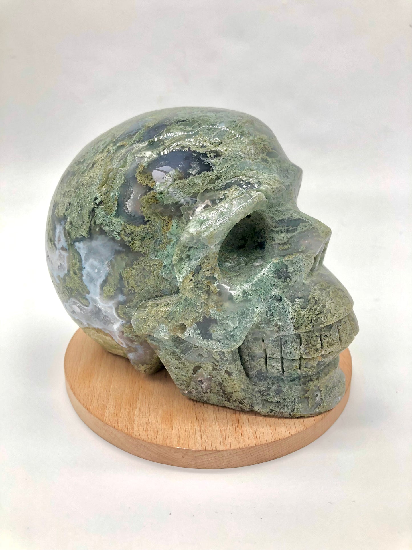 Moss agate skull carving