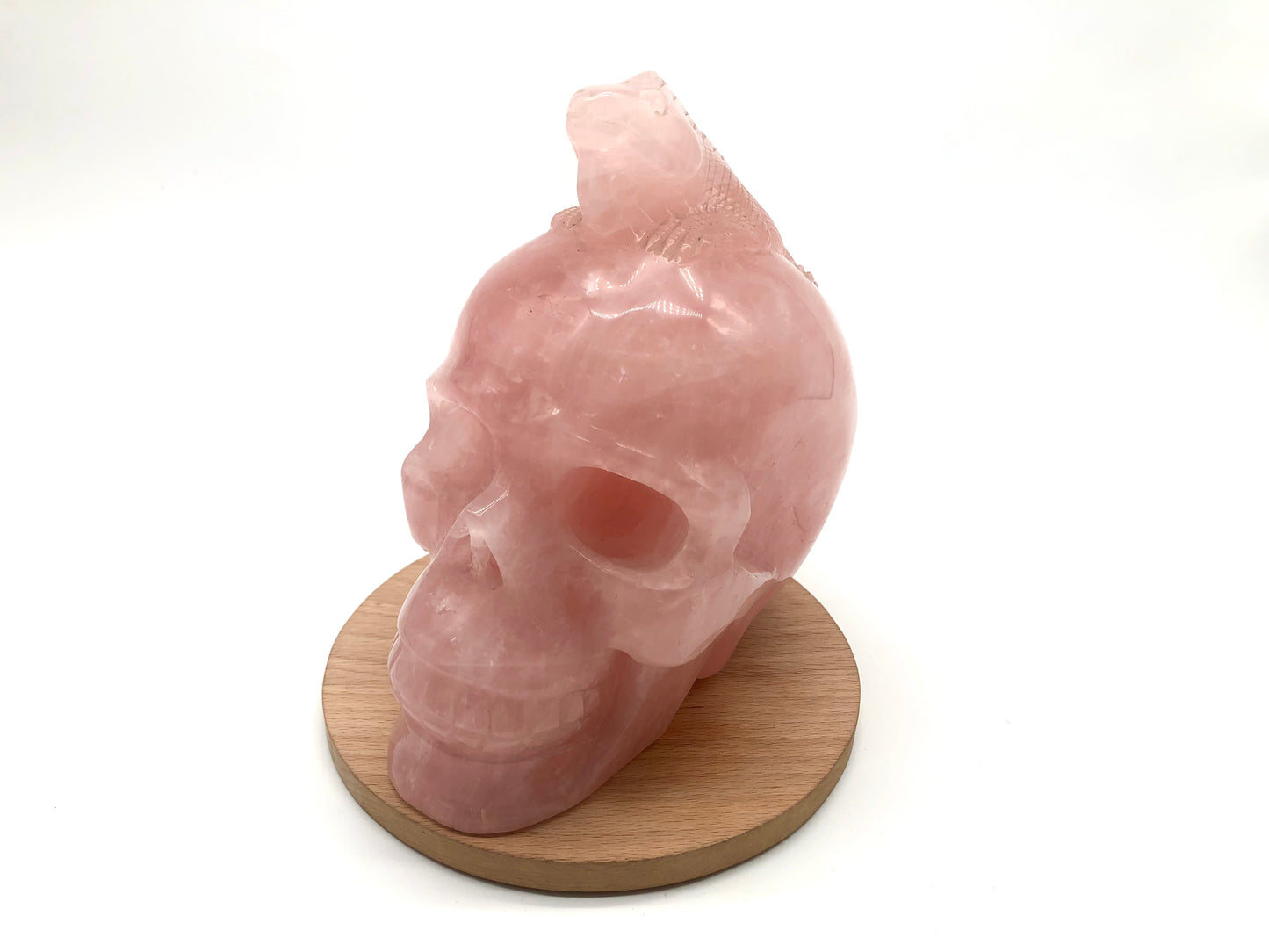 Rose quartz skull with lizard carving