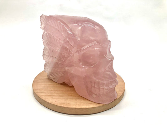 Rose quartz skull with leaves carving