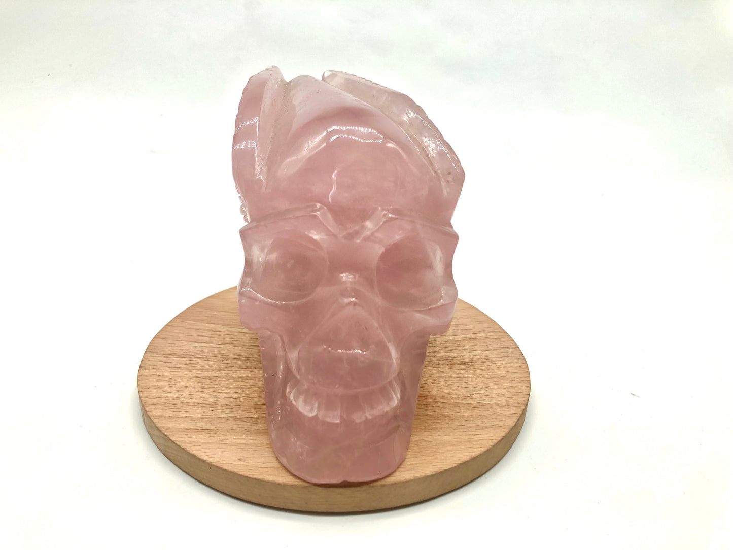 Rose quartz skull with leaves carving