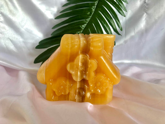 Orange calcite house carving