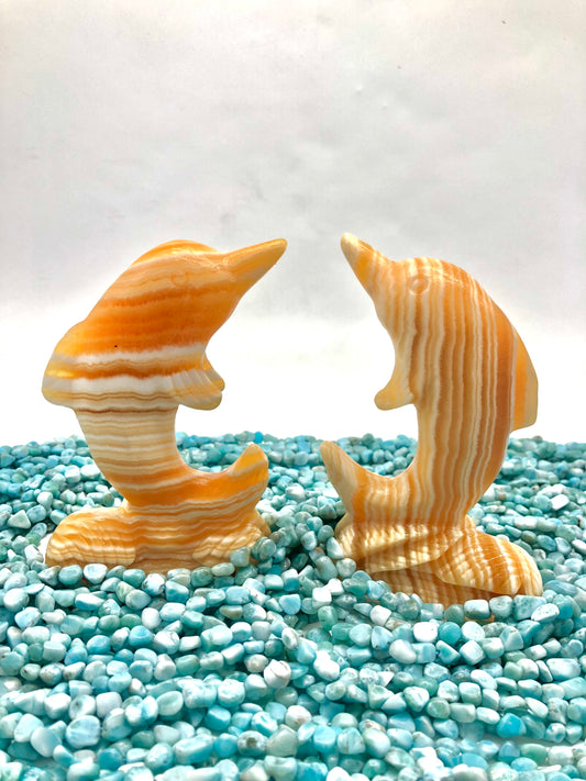 Orange calcite dophin carving