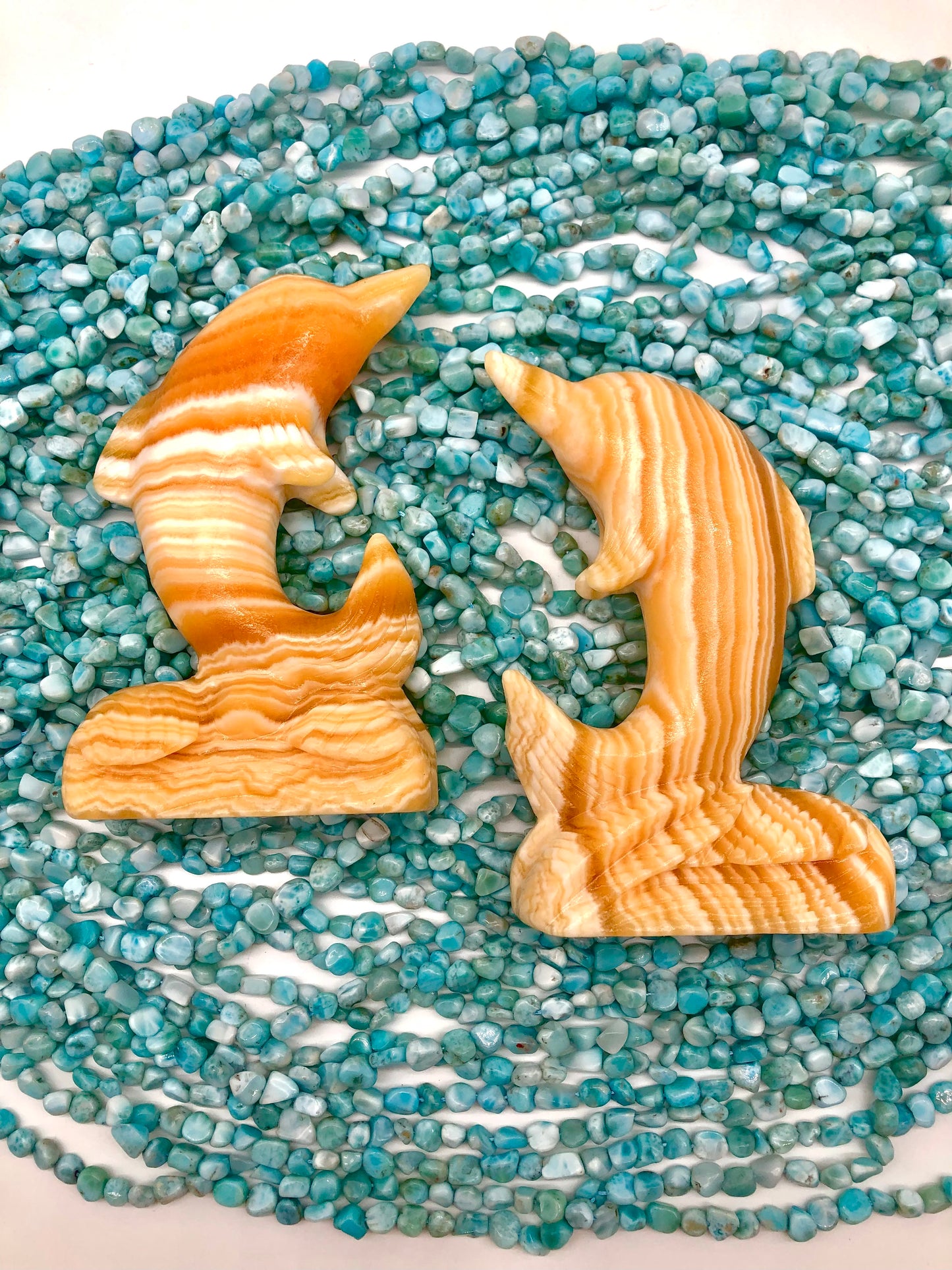 Orange calcite dophin carving