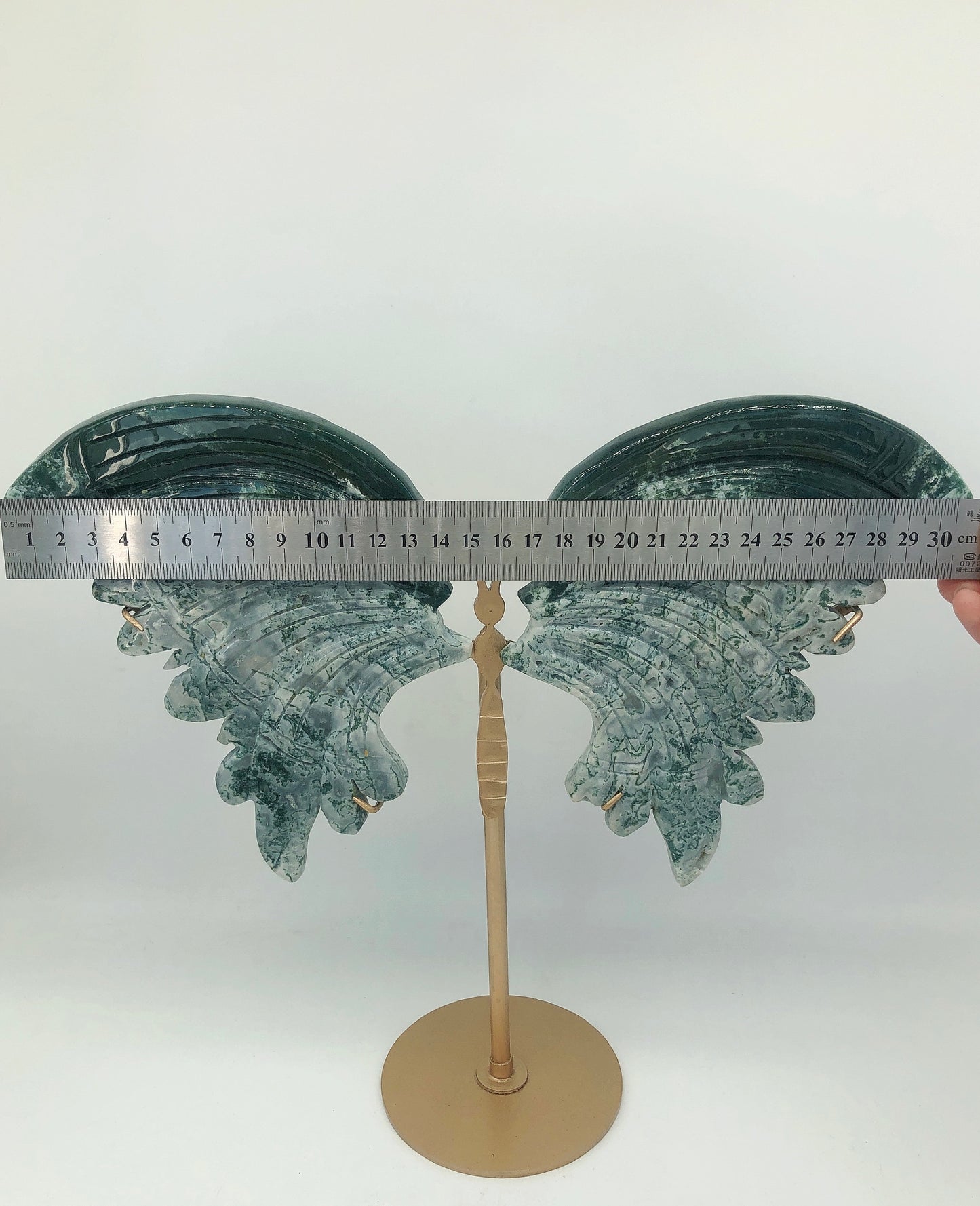 Moss agate wing carving